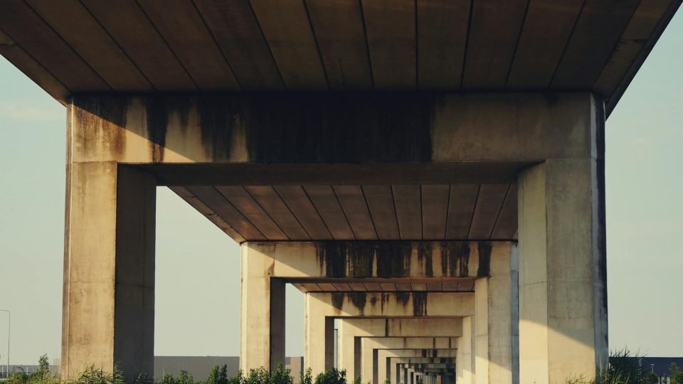 Concrete overpass showing symmetry and urban architecture in daylight.